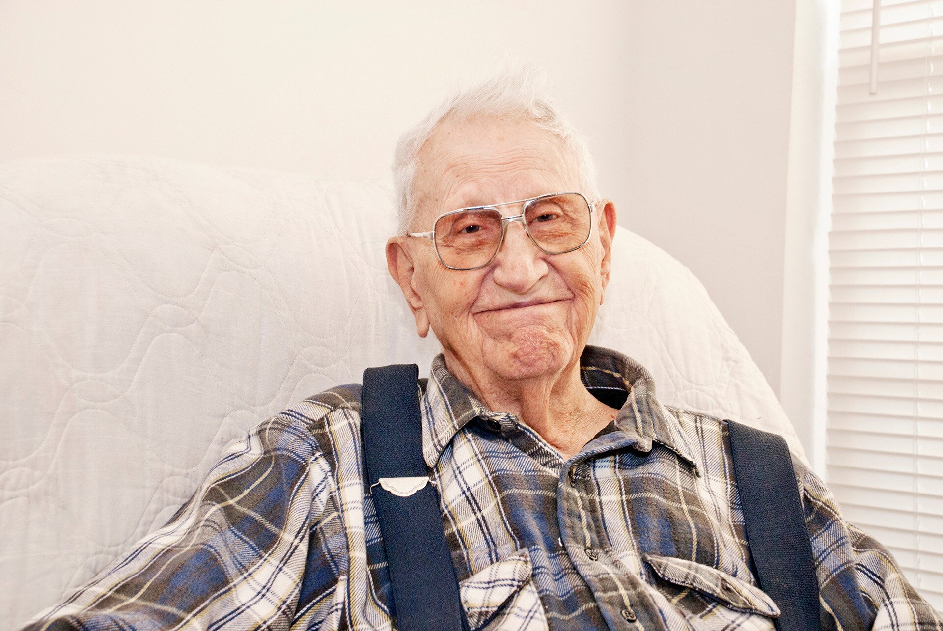elderly-father-sitting-looking-at-camera